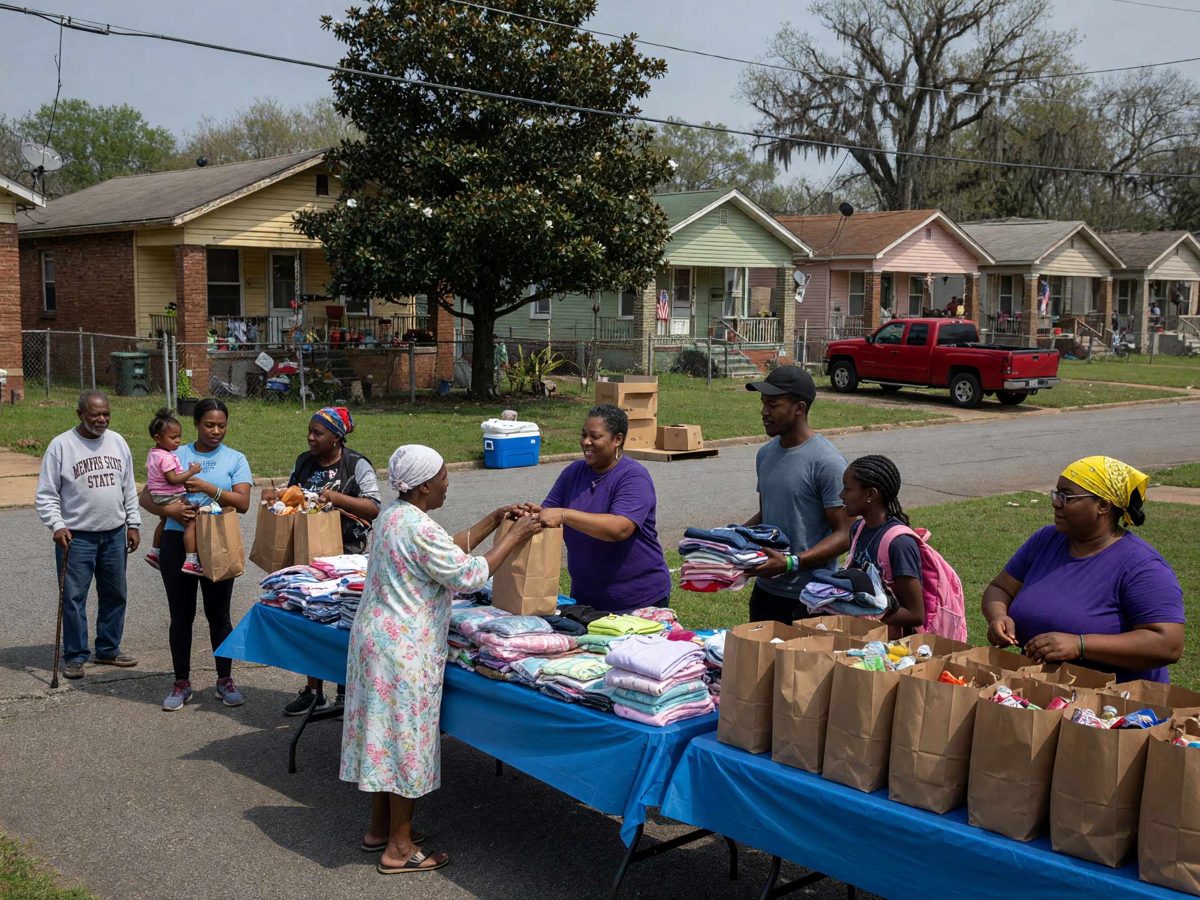 Volunteers serving neighbors at an outdoor outreach day